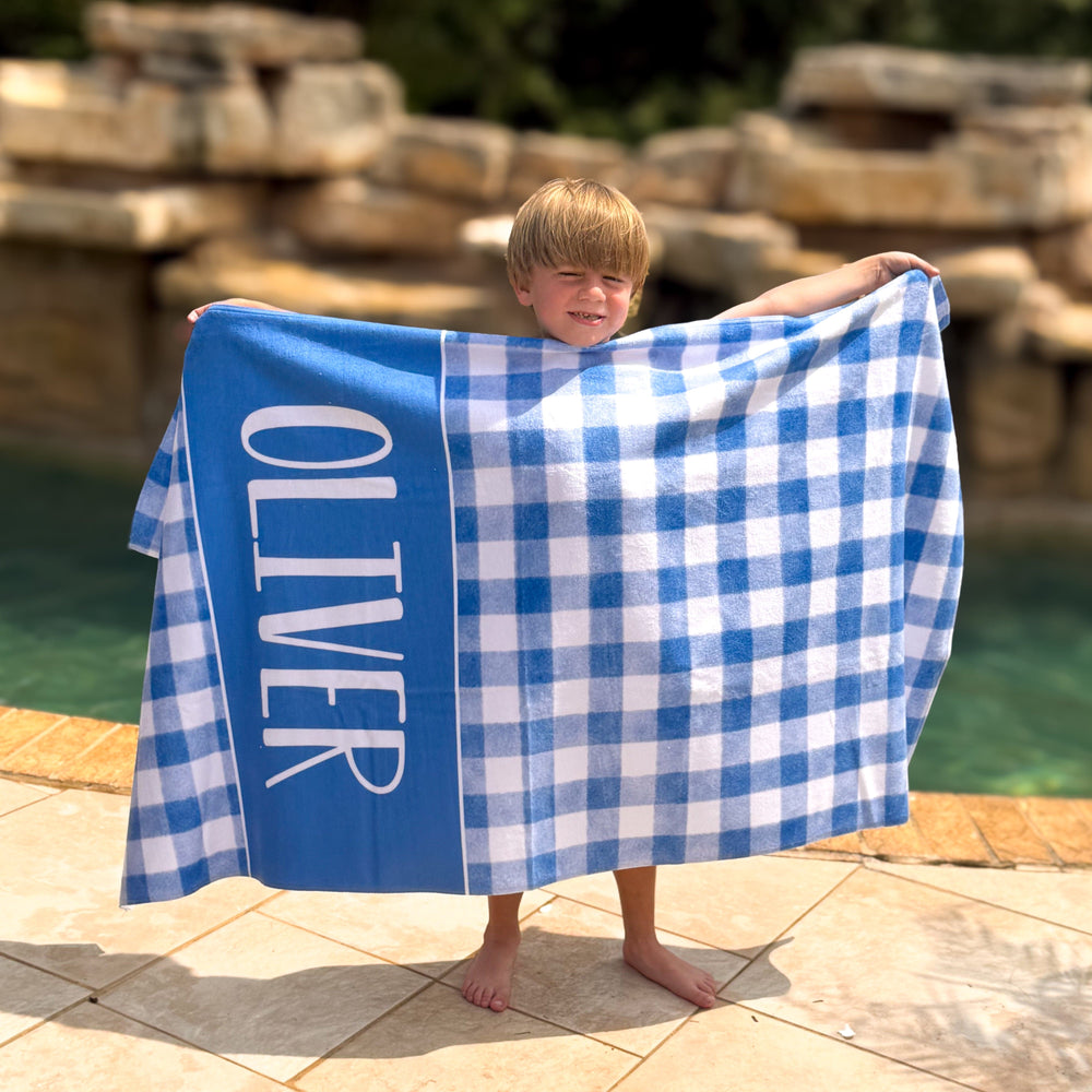 Photo of Boy by a pool with a Blue Gingham Personalized Beach Towel 